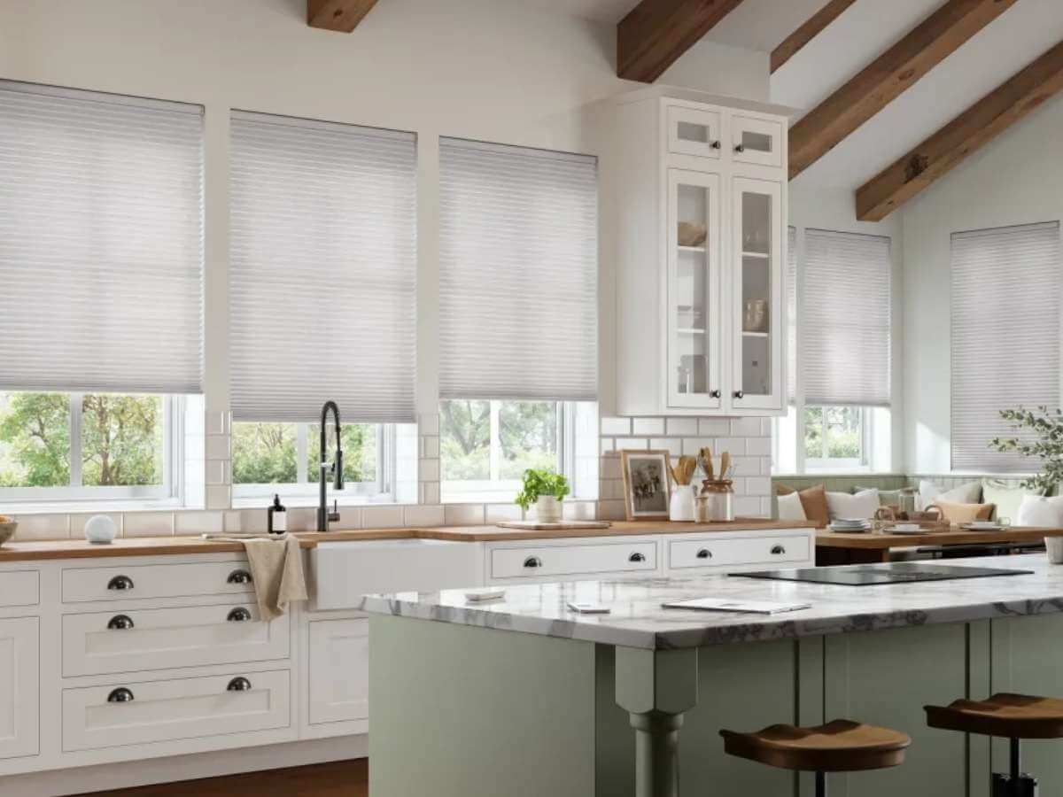 alta window fashions honeycomb shades (or cellular shades) installed in the kitchen